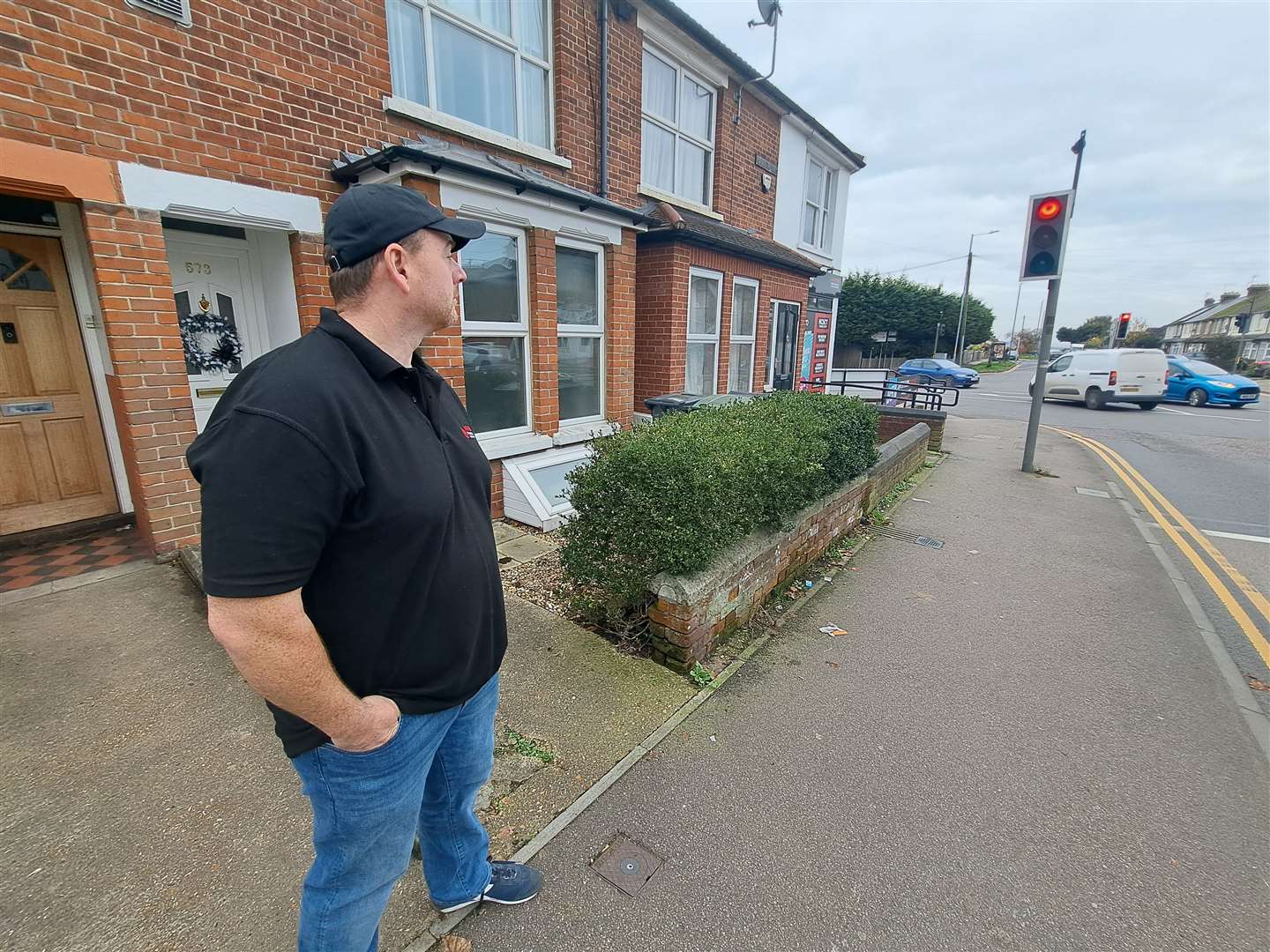 Damien McArdle looks down the street in vain for a postman