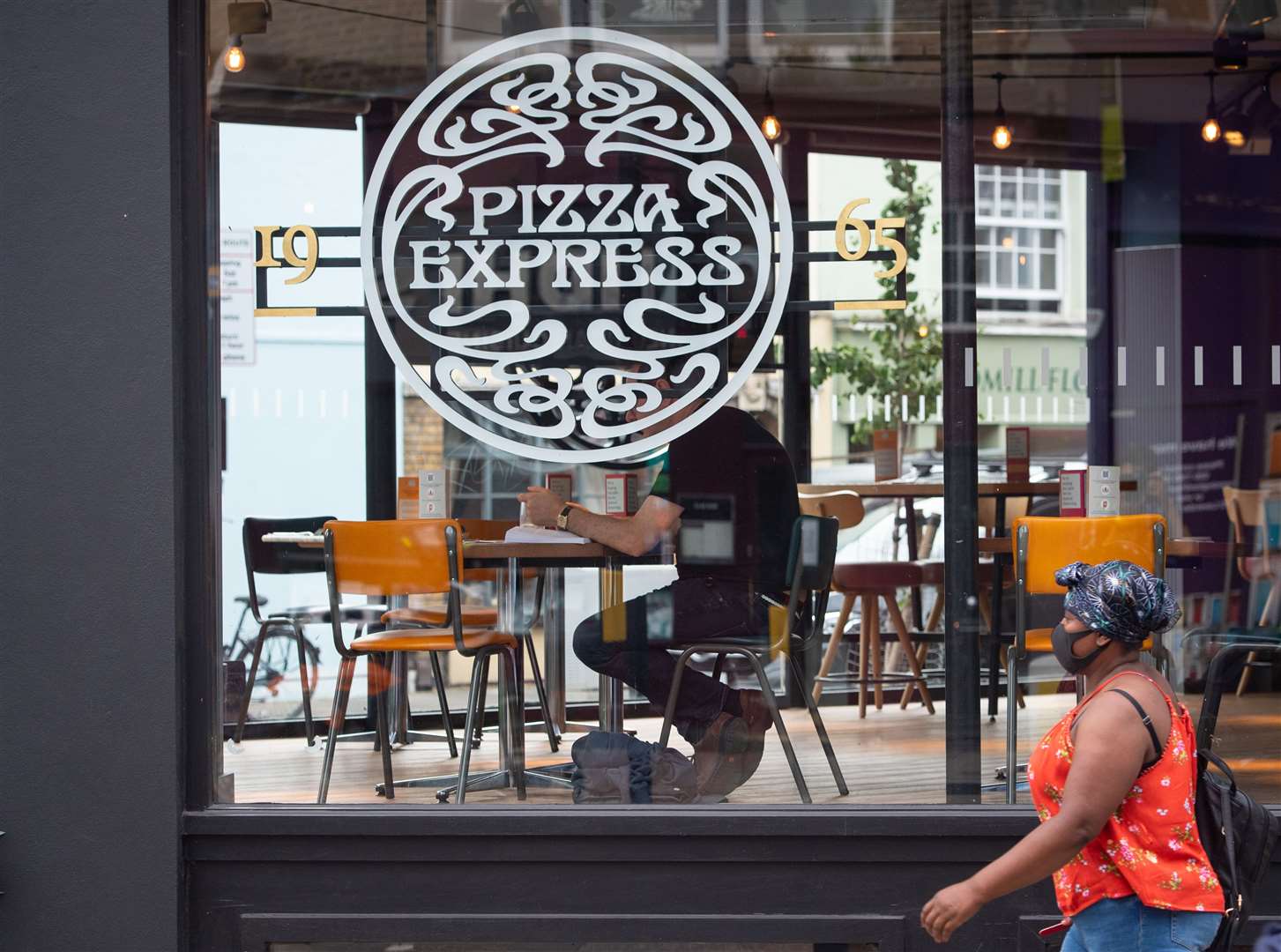 Pizza Express cut its debt load by £400 million in a refinancing move (Dominic Lipinski/PA)