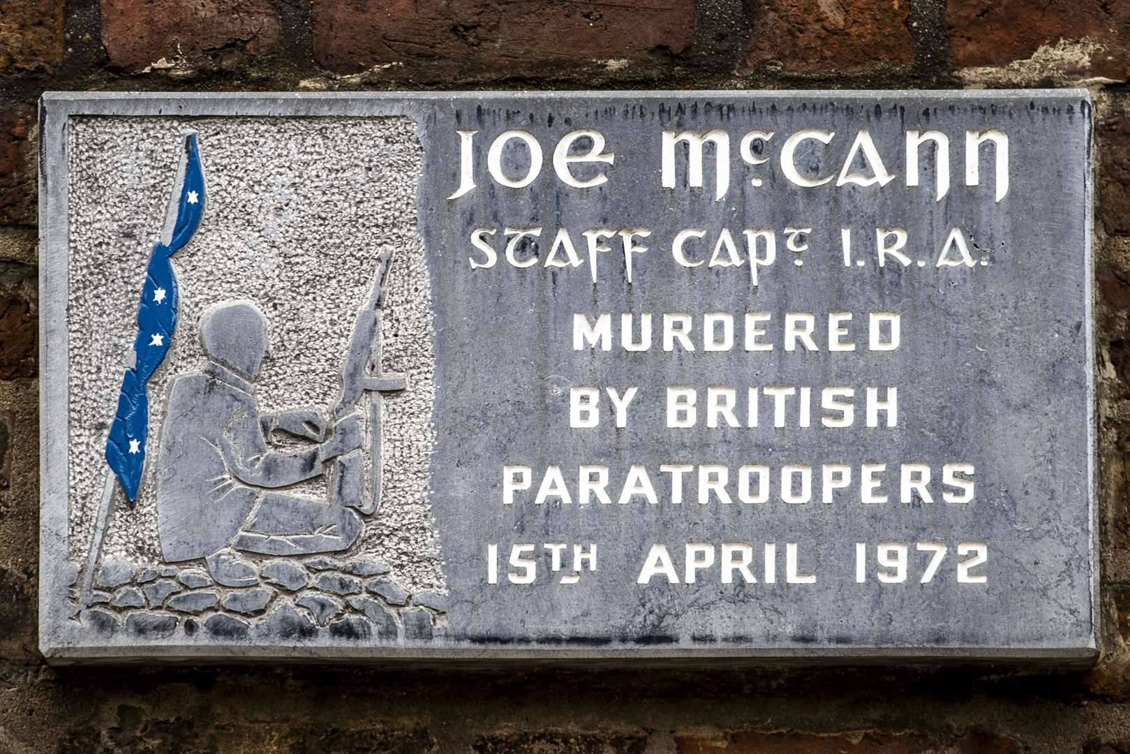 A plaque on the spot where Joe McCann was shot dead on Joy Street in Belfast (Liam McBurney/PA)