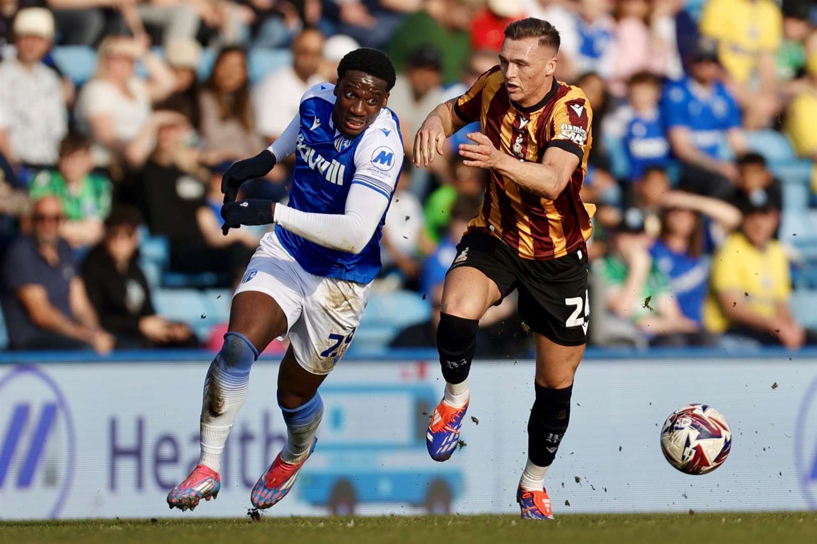 Gillingham forward Joe Gbode takes on Jack Shepherd Picture: @Julian_KPI