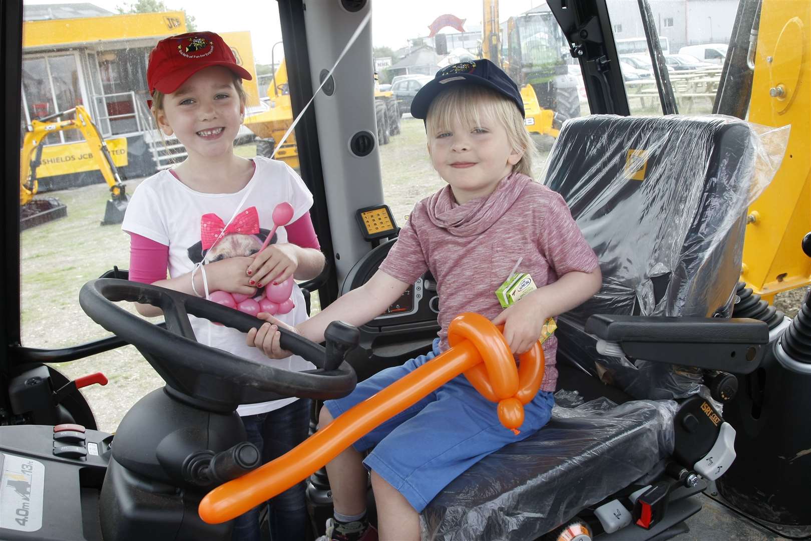 Lily Foyle and Zachary Foyle enjoying the attractions at Diggerland in 2012. Picture: Peter Still