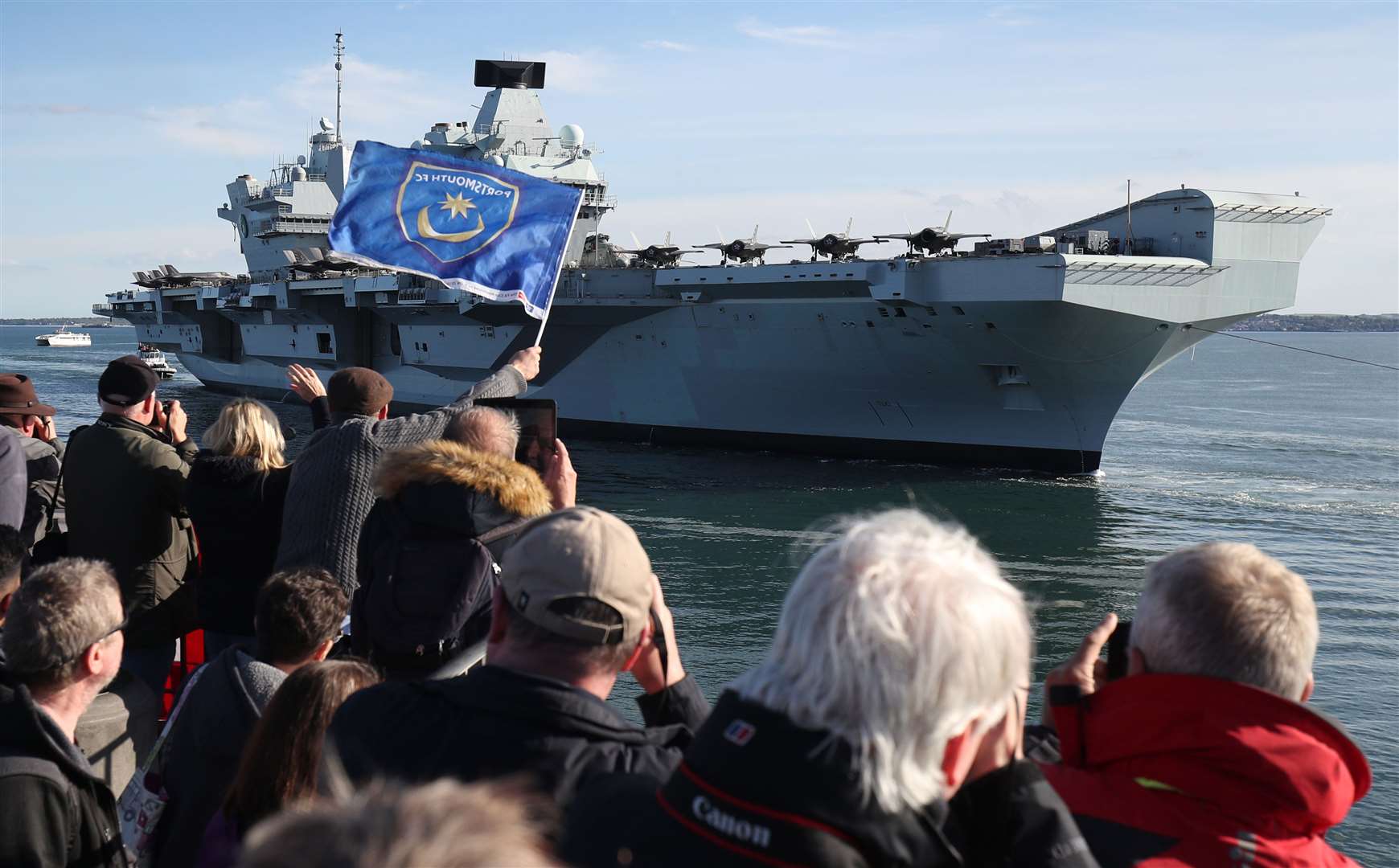 HMS Queen Elizabeth arrives back at Portsmouth Naval Base (Steve Parsons/PA)