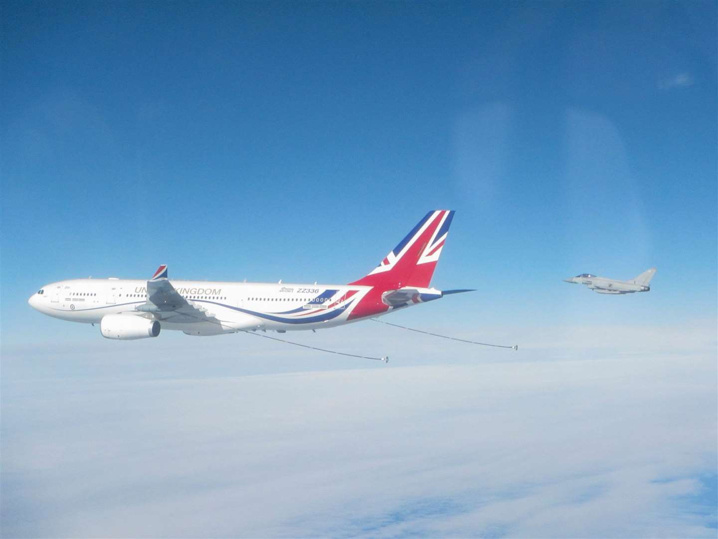 Two Typhoons from RAF Lossiemouth are seen after linking up with the newly re-painted RAF Voyager (RAF/PA)