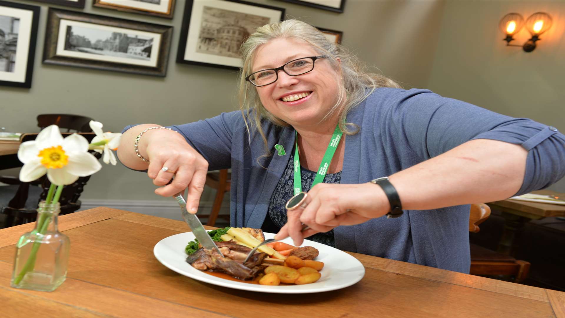 Rachel Gascoigne, partnership manager at Macmillan Cancer Support, tucking into a roast