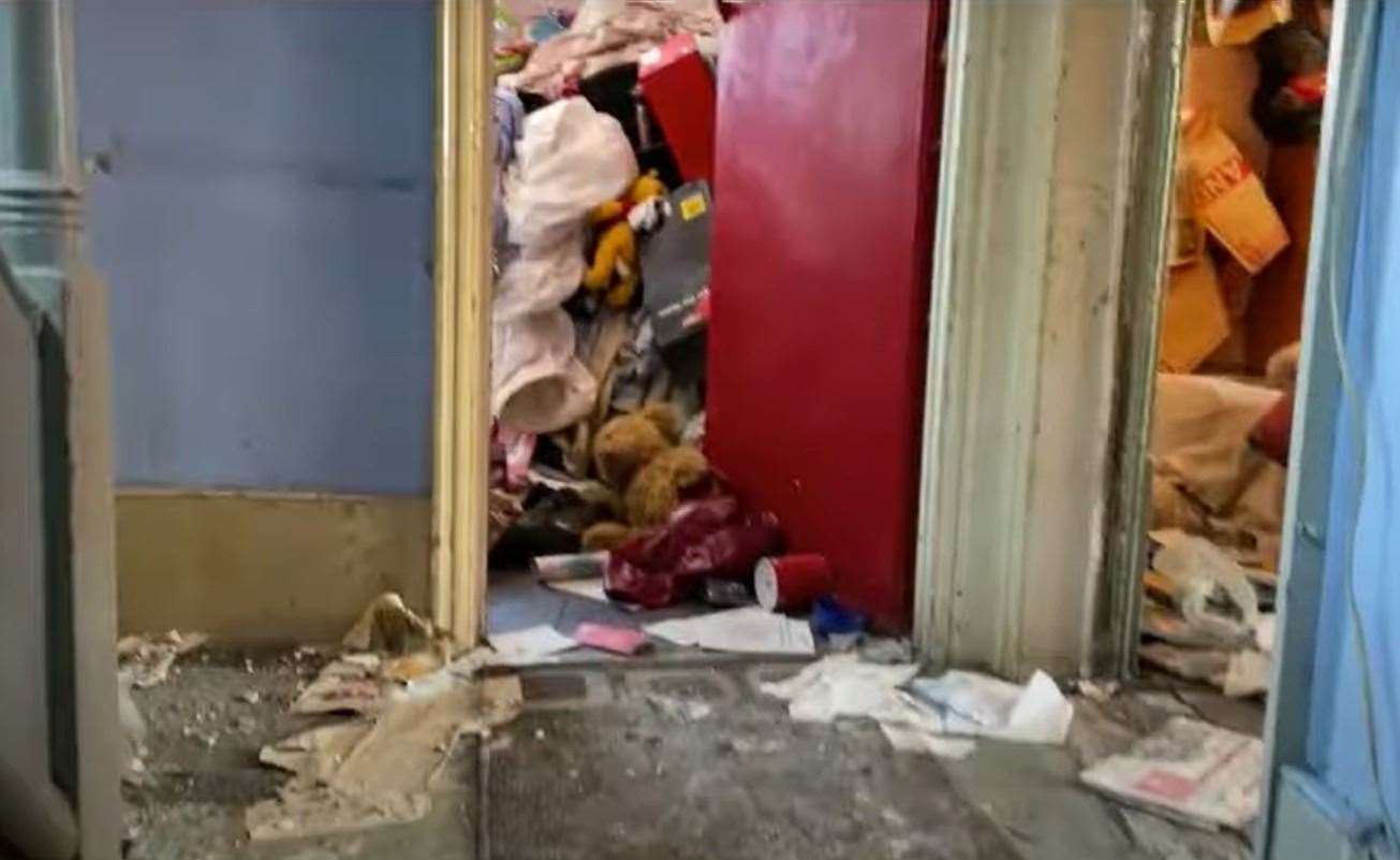 One of the rooms upstairs appears cluttered with belongings. Picture: Clive Emson / YouTube