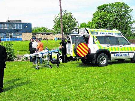 A pupils is treated for shock near the college gate