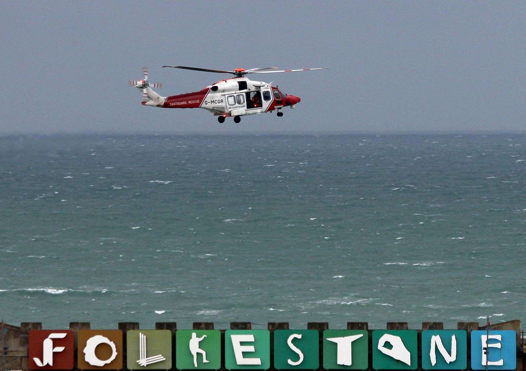 A coastguard helicopter was seen searching the sea near Folkestone beach. Picture: Dover Strait Shipping - FotoFlite