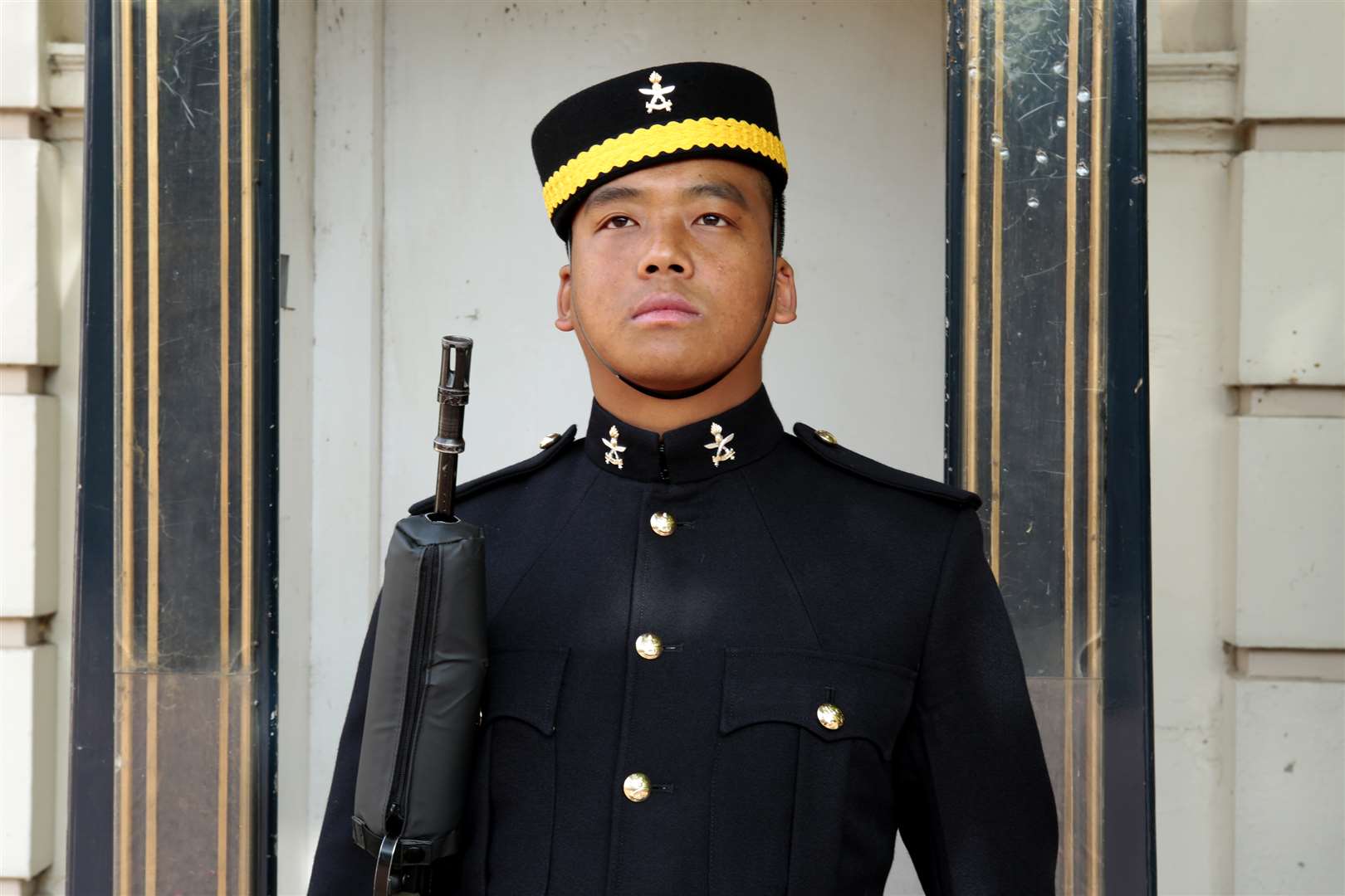 One of the Queen's Gurkha Engineers takes his post as a guard at St James' Palace. Picture: Martin Apps