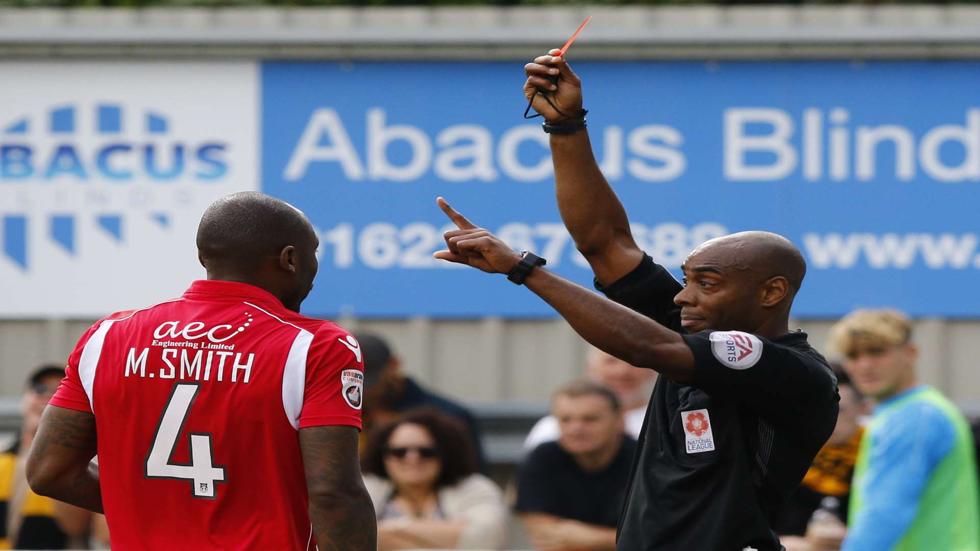 Wrexham's Manny Smith is sent off by referee Sam Allison. Picture: Andy Jones