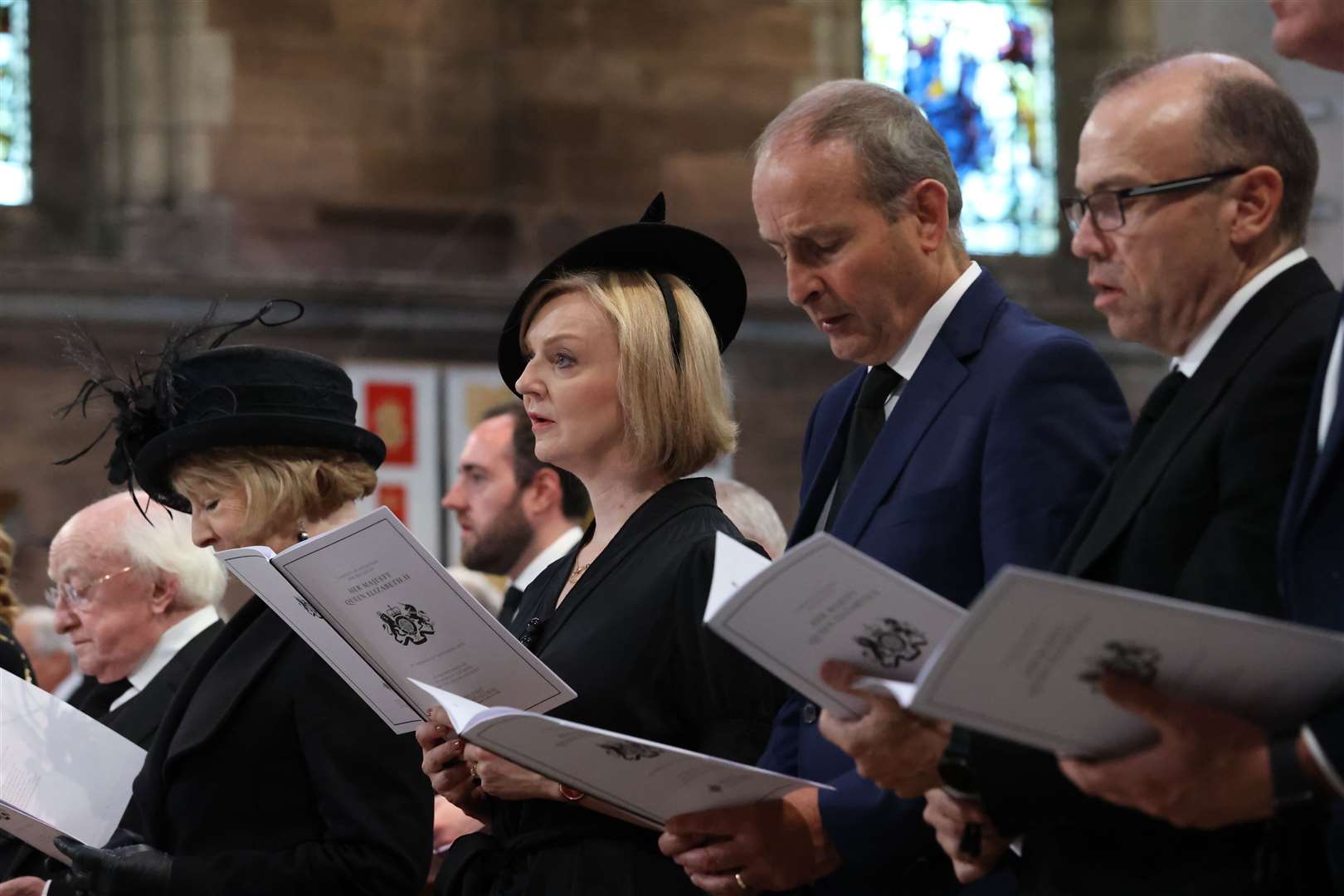 President Michael D Higgins and his wife Sabina, Prime Minister Liz Truss, Taoiseach Micheal Martin and Secretary of State Chris Heaton-Harris at the service (Liam McBurney/PA)