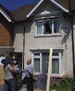 HERO: Frank Homewood talks to a camera crew outside the house. Picture: JOHN WESTHROP