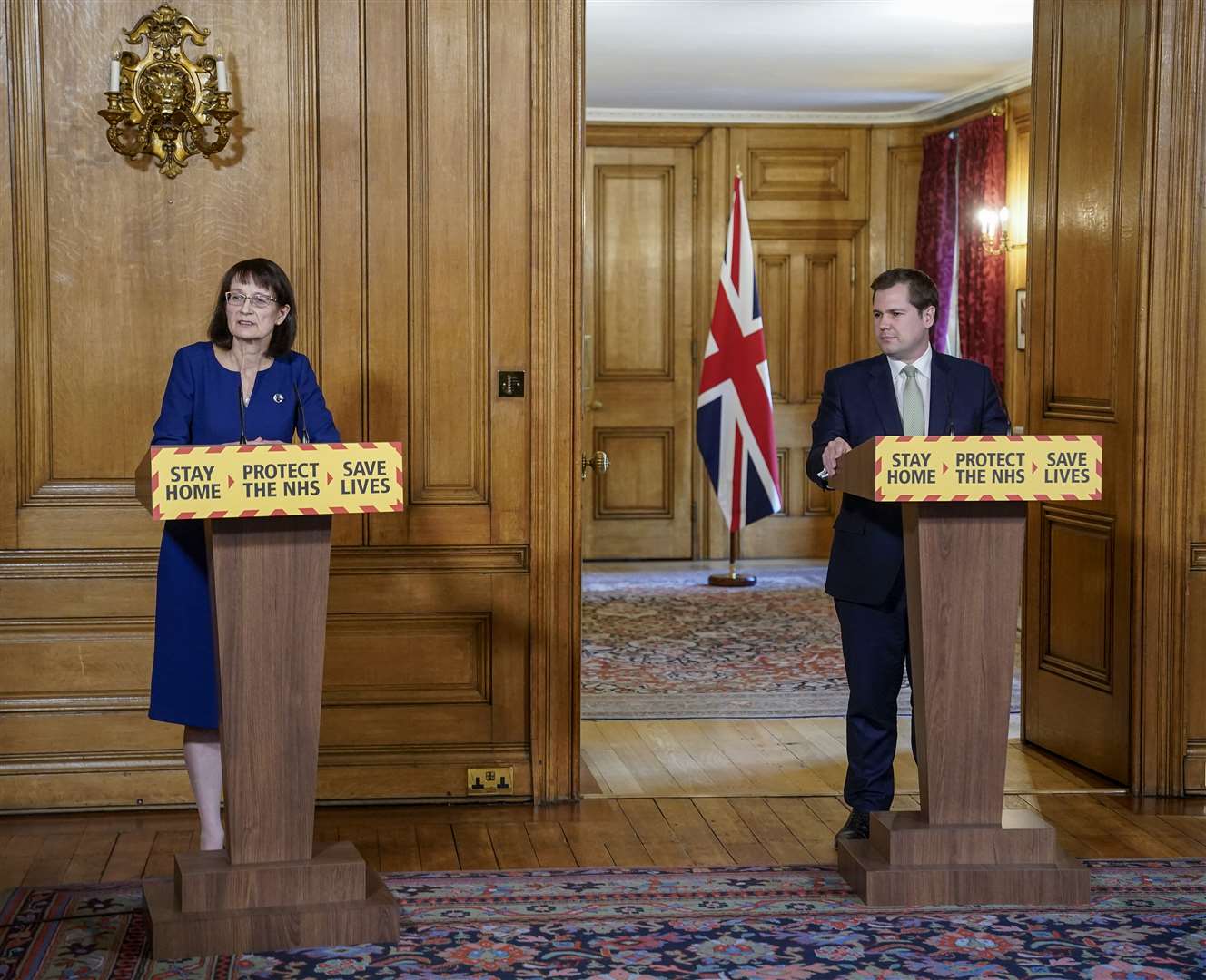 Handout photo issued by 10 Downing Street of Deputy Chief Medical Officer Dr Jenny Harries and Housing, Communities and Local Government Secretary Robert Jenrick during a media briefing in Downing Street (Andrew Parsons/Downing Street/PA)