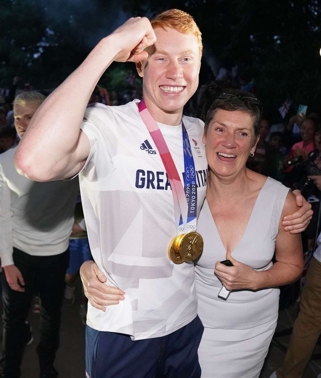 British swimmer Tom Dean, with his mother Jacquie Hughes, at a welcome home party (Jonathan Brady/PA)