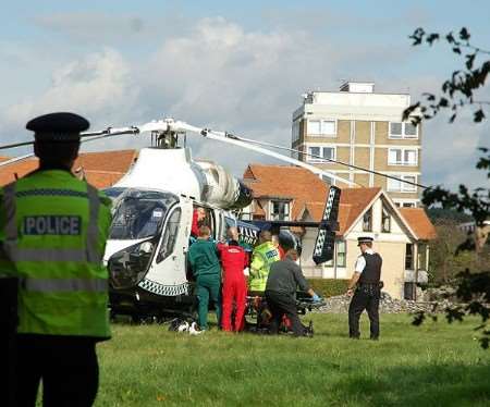 The victim is put into the Kent Air Ambulance before being flown to hospital. Picture: Gerry Warren