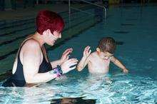 Oliver with mum Natalie, happy in the pool