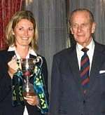 Prince Philip presents Charlotte Edwards with the Lady Taverners Trophy