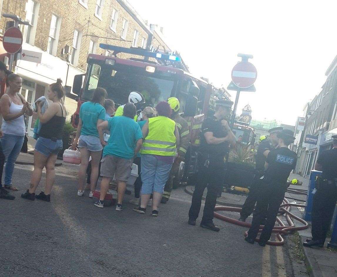 People were evacuated as black smoke engulfed the street and the building. Picture: @IT0nic/Twitter