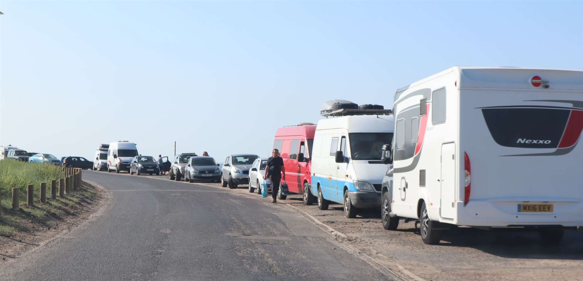 Motorhomes and campervans parked along the seawall at Shellness, Leysdown, Sheppey