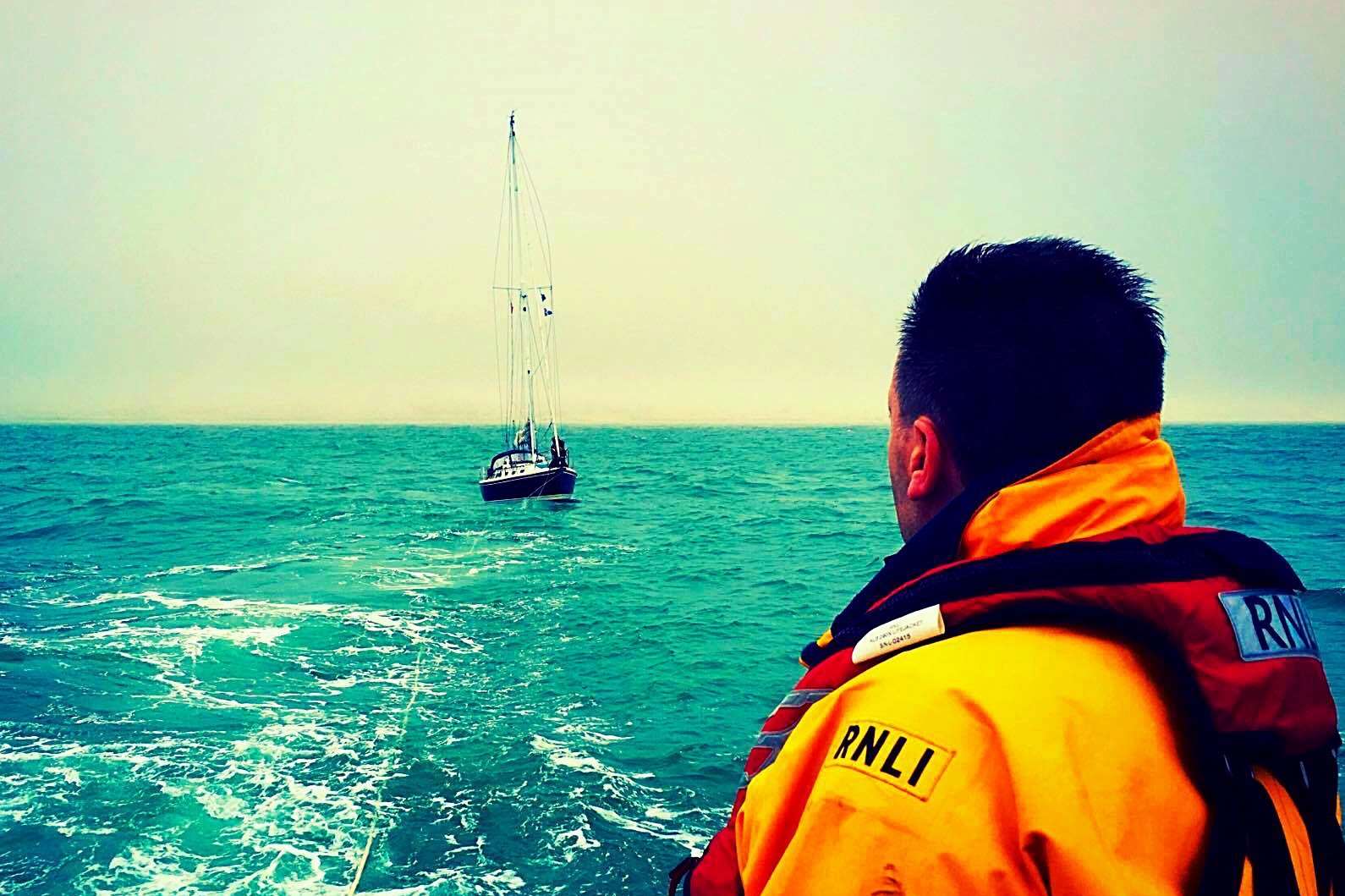 A Dover lifeboatman views as the Dutch yacht is towed to safety. Picture by Alex Miller.