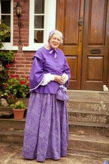 Jennifer Papadopulos in her Dickensian outfit ahead of the torch coming through Higham