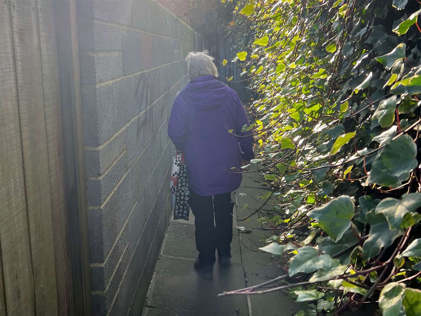 Betty, 79, walking down a Sheerness alleyway. Picture: Megan Carr