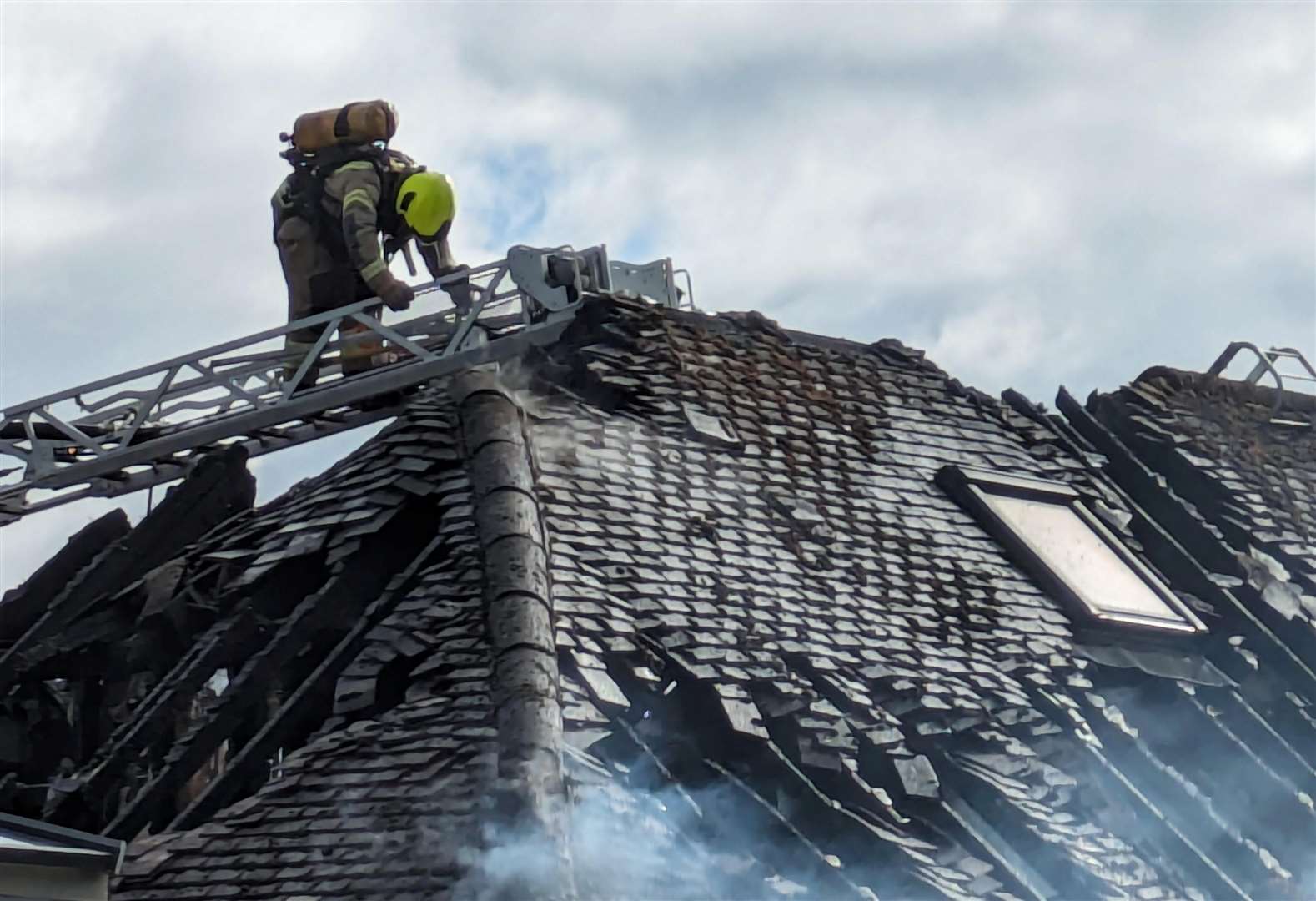 Fire crews used an extended ladder to reach the blaze