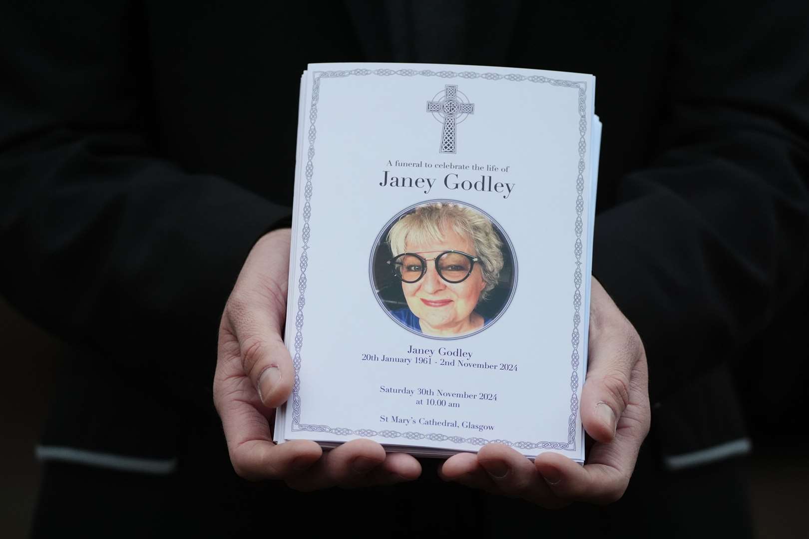 A mourner holds the order of service for the funeral of Scottish comedian Janey Godley (Andrew Milligan/PA)