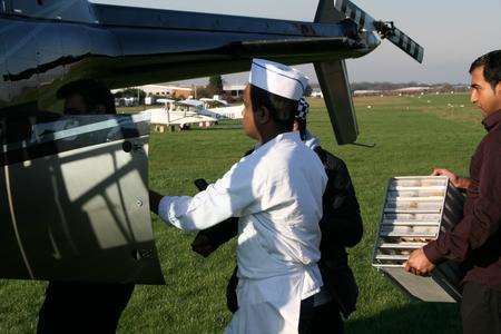 Staff at Taj Cuisine in Lower Stoke prepare to deliver Indian meal to Congo.