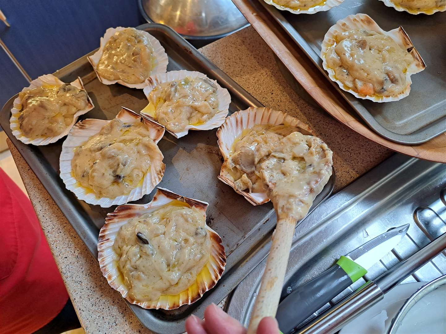 Preparing the scallops for grilling