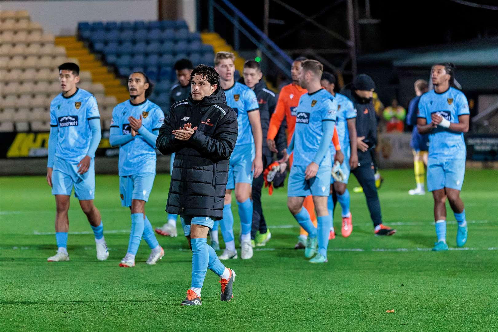 Stones players show their appreciation to the 34 away fans at Torquay. Picture: Helen Cooper