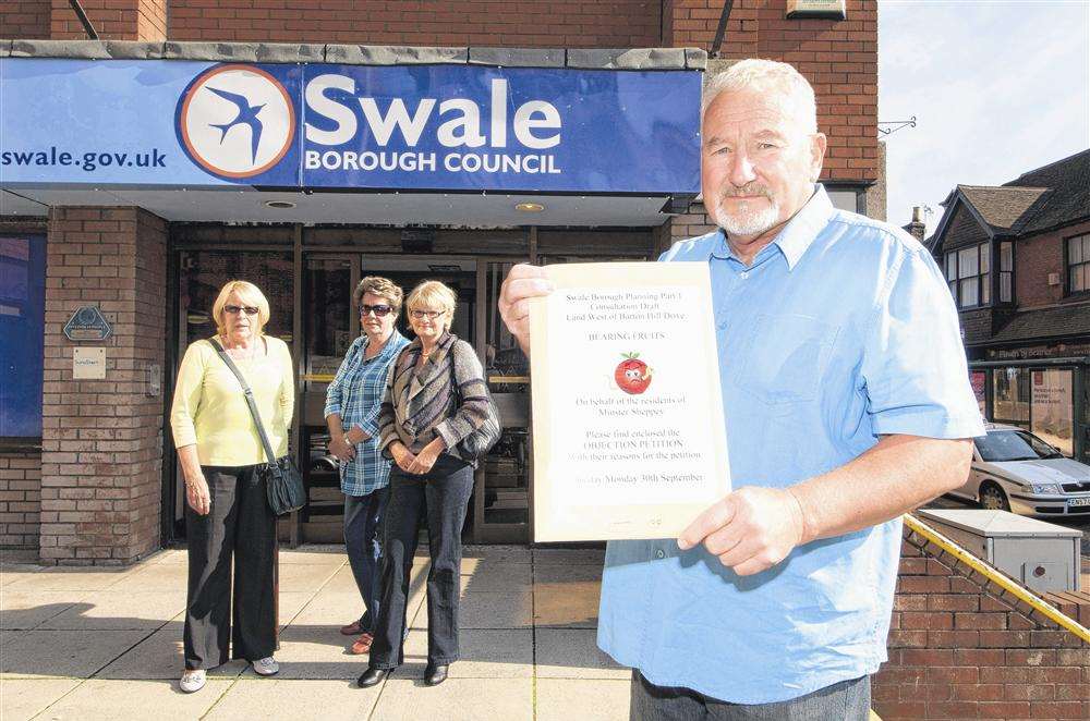Minster resident Alan Bengall presenting the petition at Swale council