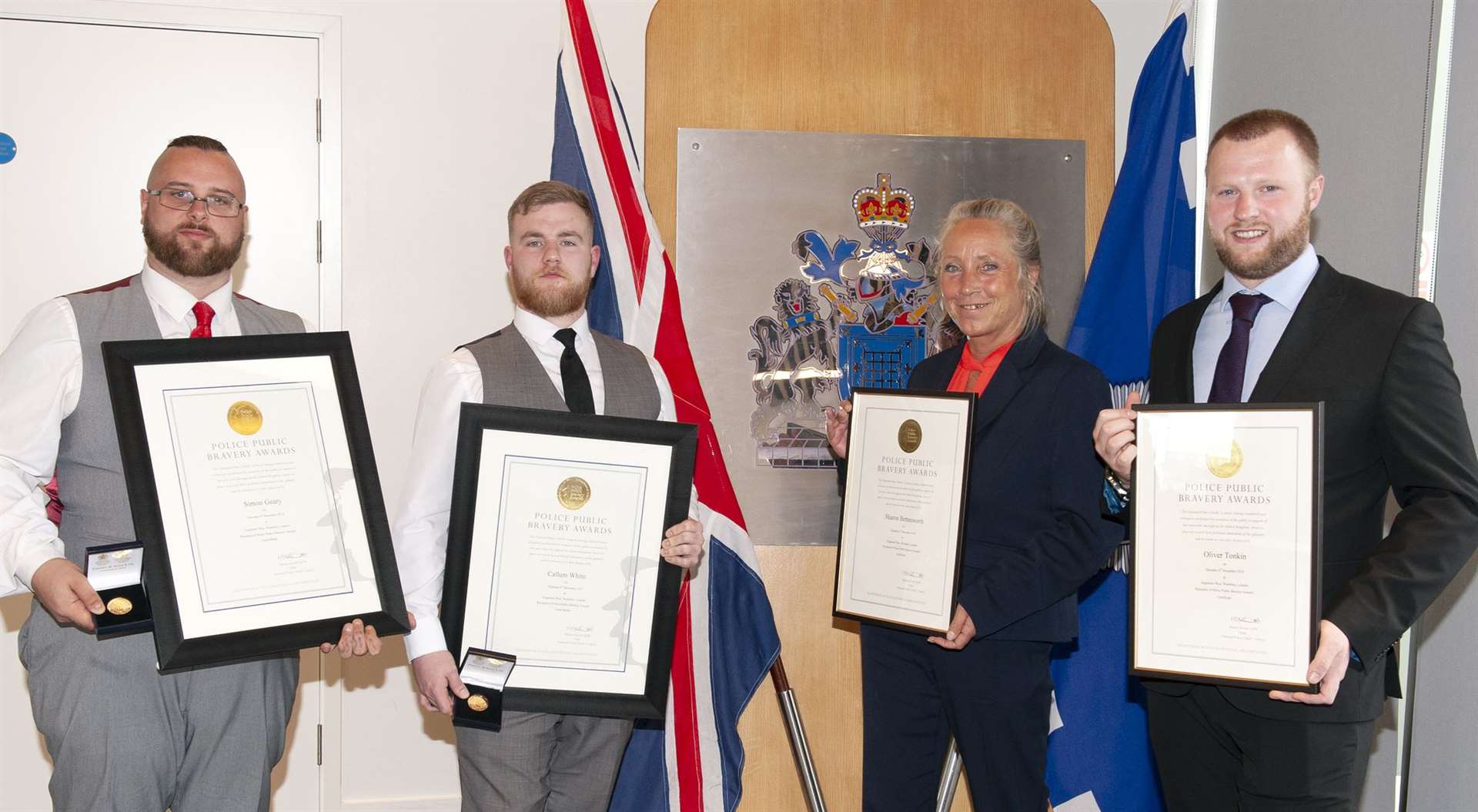 Simon Geary and Callum White, who were awarded the National Police Chiefs’ Council (NPCC) public bravery award gold medals, while Sharon Bettesworth and Oliver Tonkin received NPCC police bravery award certificates of commendation (Metropolitan Police/PA)