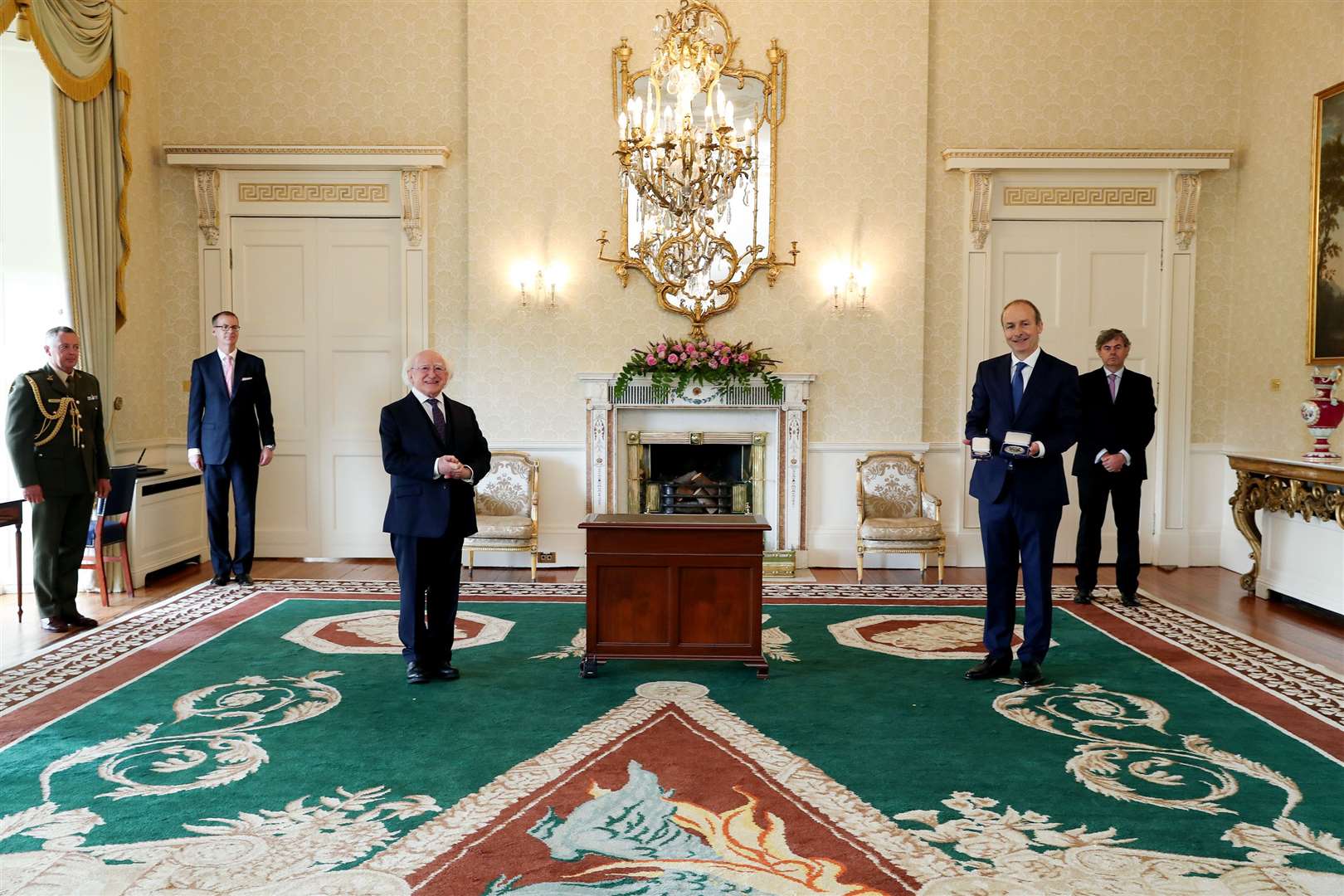 Fianna Fail leader Micheal Martin being presented the Seal of Office by President Michael D. Higgins at Aras an Uachtarain in Dublin as he became Taoiseach (Maxwell Photography/PA)