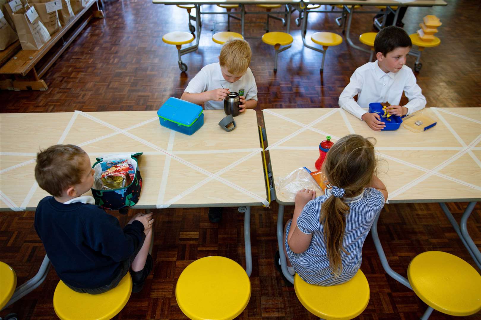 Children eating lunch in segregated positions at Kempsey Primary School in Worcester (Jacob King/PA)