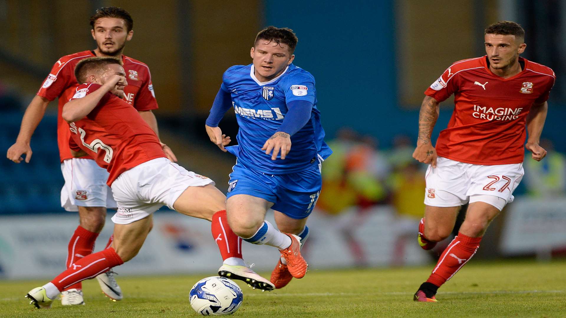 Gillingham's Billy Knott is brought down by Swindon's Anton Rodgers. Picture: Ady Kerry