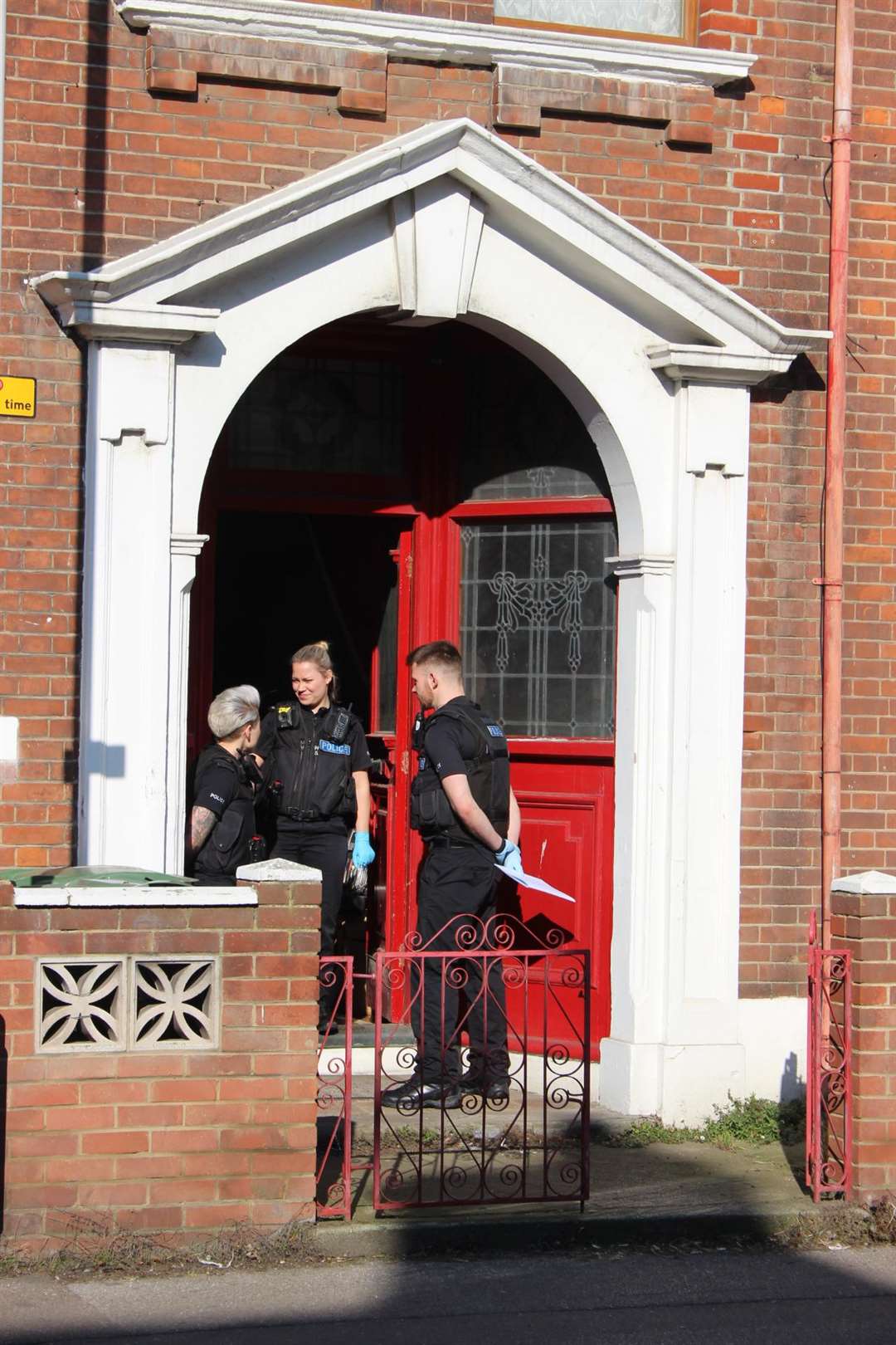 Police officers guard the red door in St George's Avenue, Sheerness, Sheppey, on Saturday (7389024)