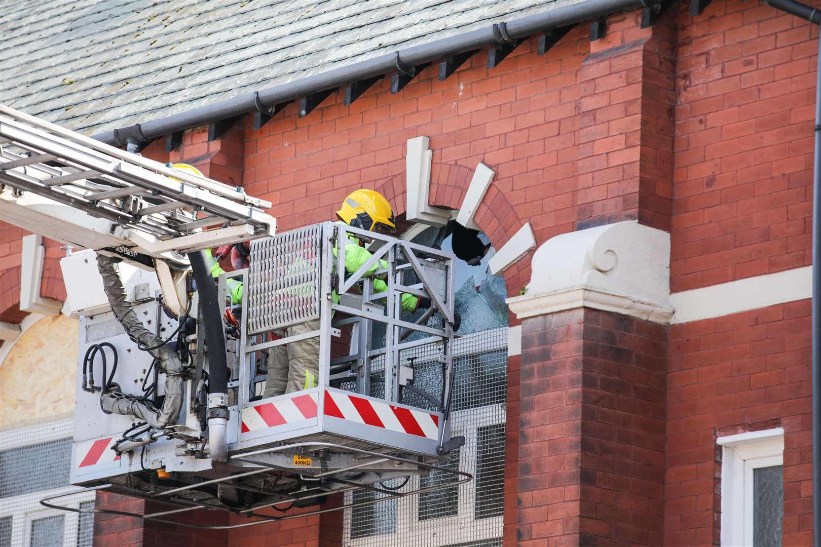 Merseyside Fire & Rescue service help repair a broken window at Southport Islamic Centre Mosque in Southport (James Speakman/PA)