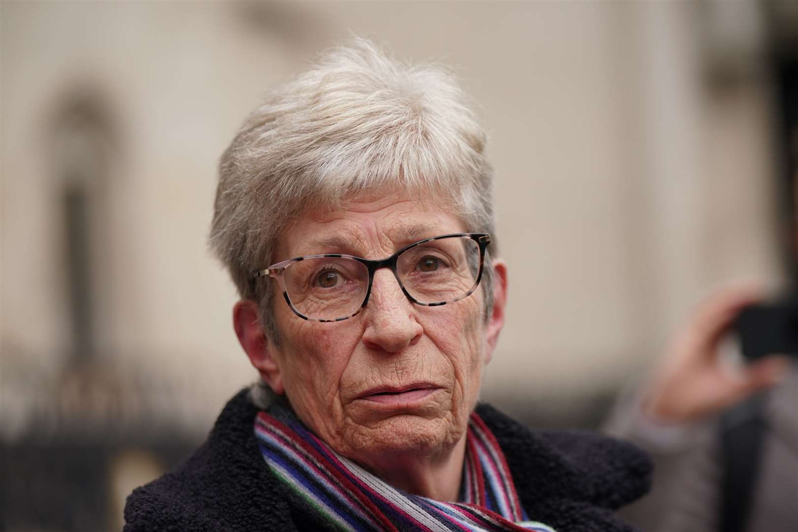 Former subpostmistress Kathleen Crane, wearing her late husband’s scarf, outside the Royal Courts of Justice (Yui Mok/PA)