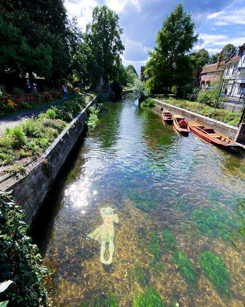 The controversial new Alluvia statue in the Stour beside the Westgate Towers in Canterbury