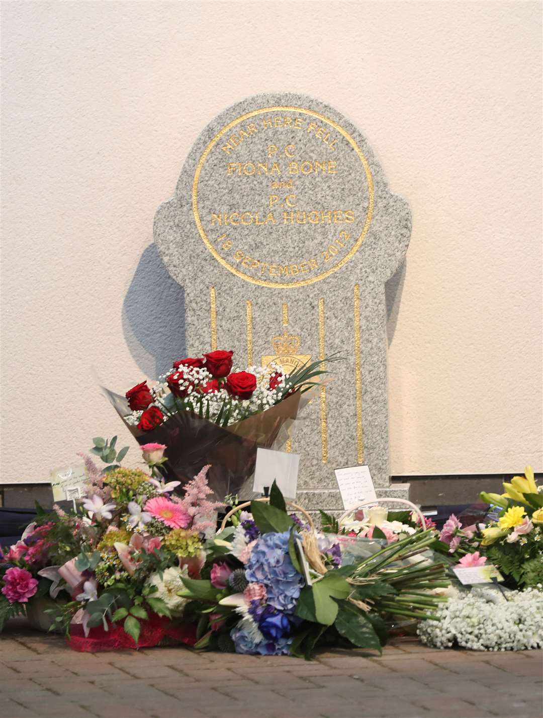 Flowers laid at a memorial stone in Mottram, Tameside, unveiled to honour Pc Fiona Bone, 32, and Pc Nicola Hughes, 23 (Owen Humphreys/PA)