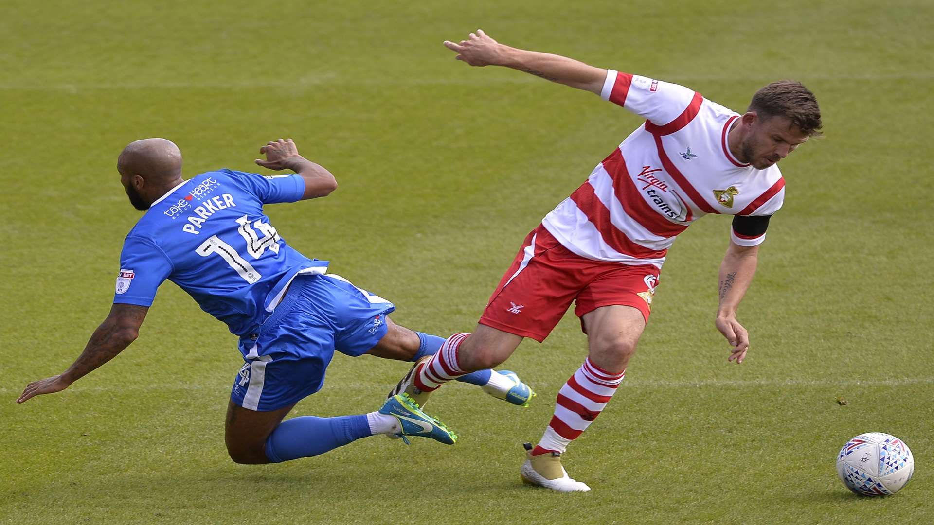 Josh Parker takes a tumble against Doncaster's Andy Butler Picture: Ady Kerry