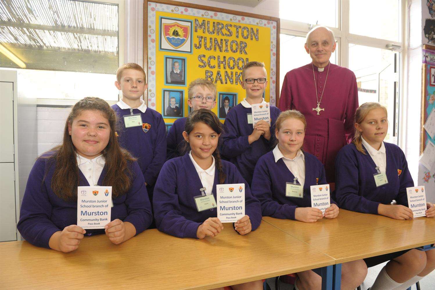 Pupils launch the Community bank with Rev Trevor Willmott