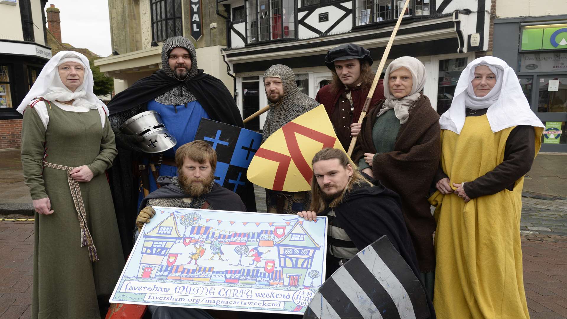 Knights, barons and medieval ladies in Faversham's Guildhall market place, promoting the town's Magna Carta Weekend in June