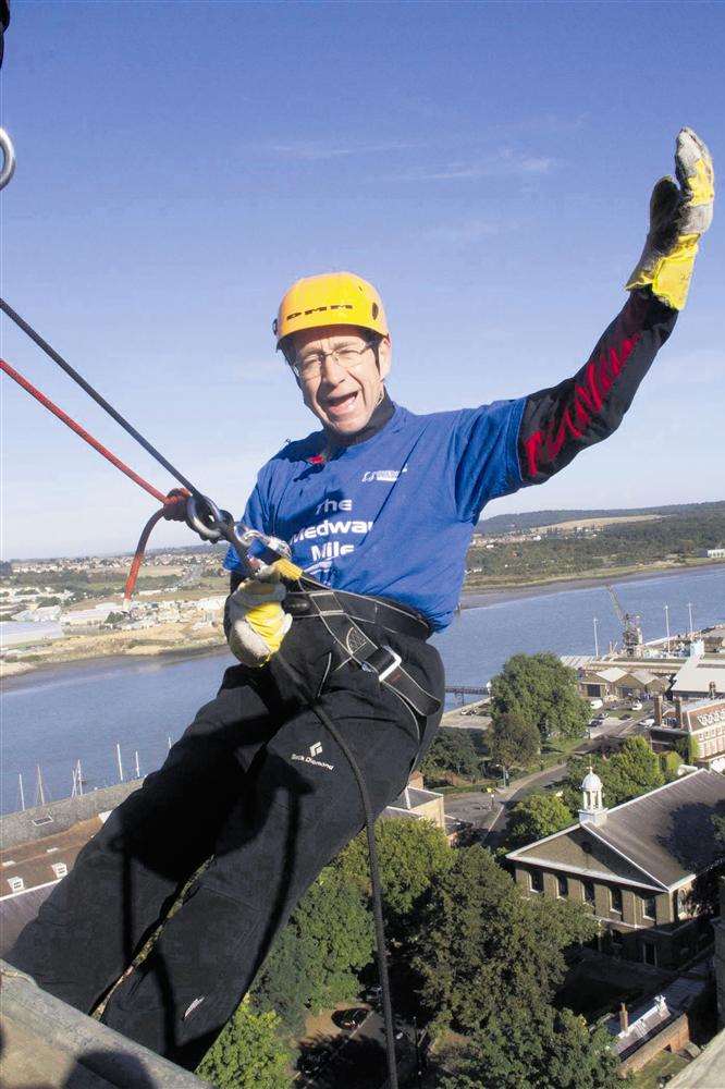 Cllr Vaughan Hewett abseiling down Melville House, Chatham