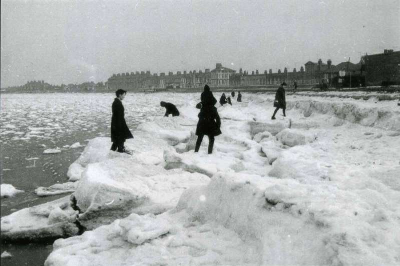 Children playing on "icebergs" on Sheerness beach in 1963