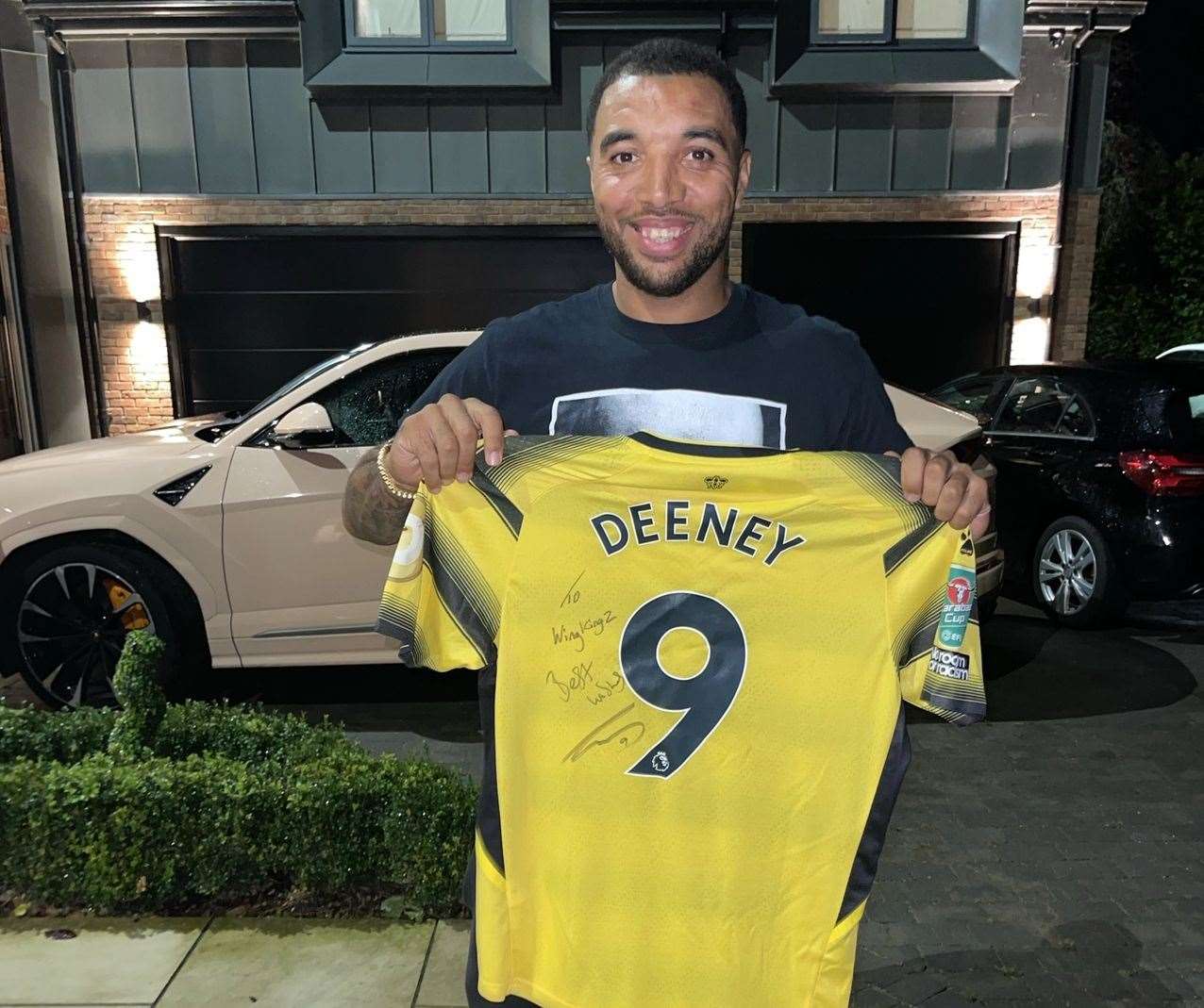 Troy Deeney poses with a Watford shirt for Wing Kingz. Pic: Aaron Murrell