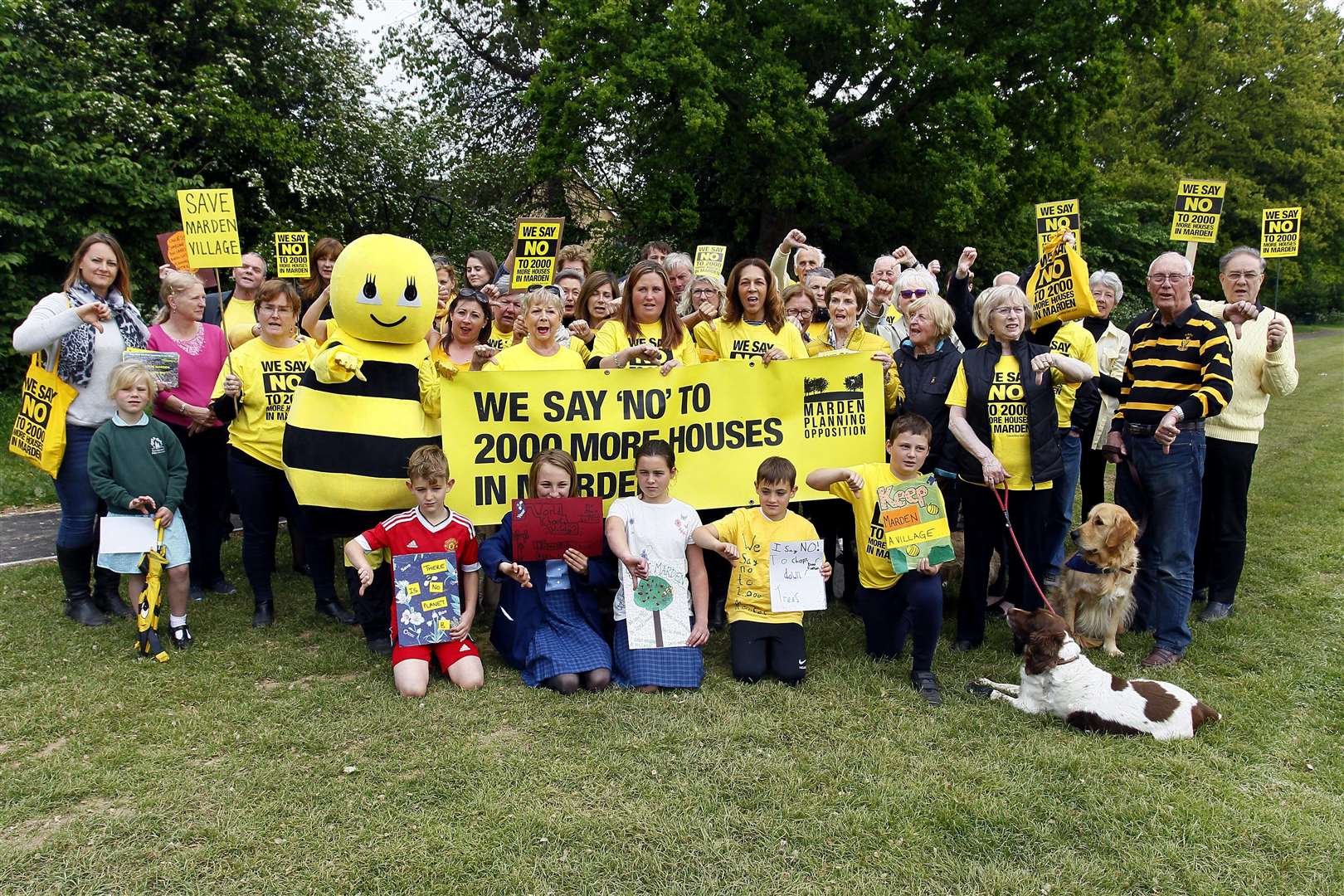 Helen Grant MP joins a group of protesters