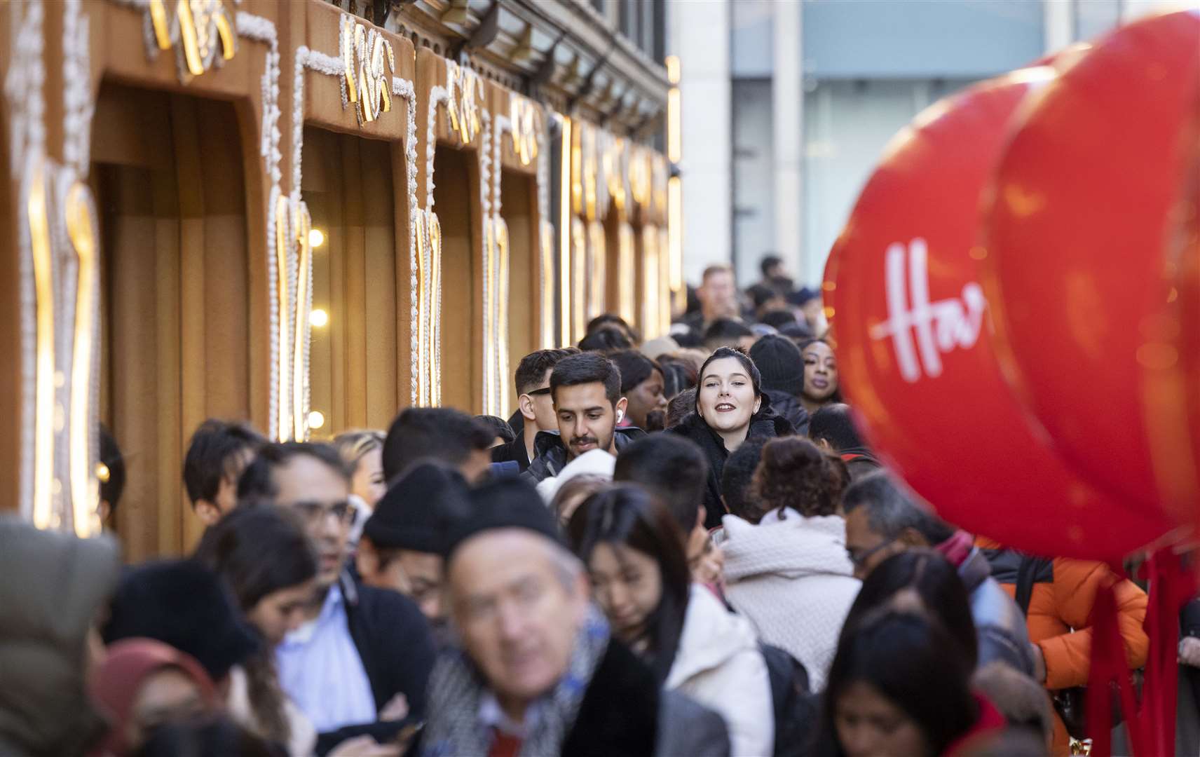 Customers queue outside Harrods in Knightsbridge (Matt Alexander/PA)