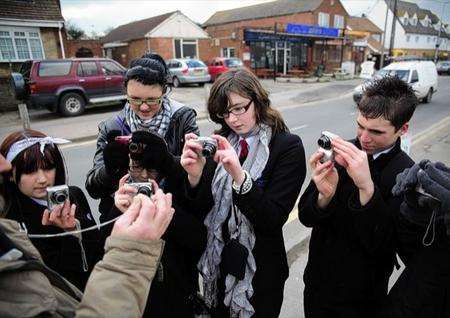 Students from the Isle of Sheppey Academy taking portraits in Leysdown