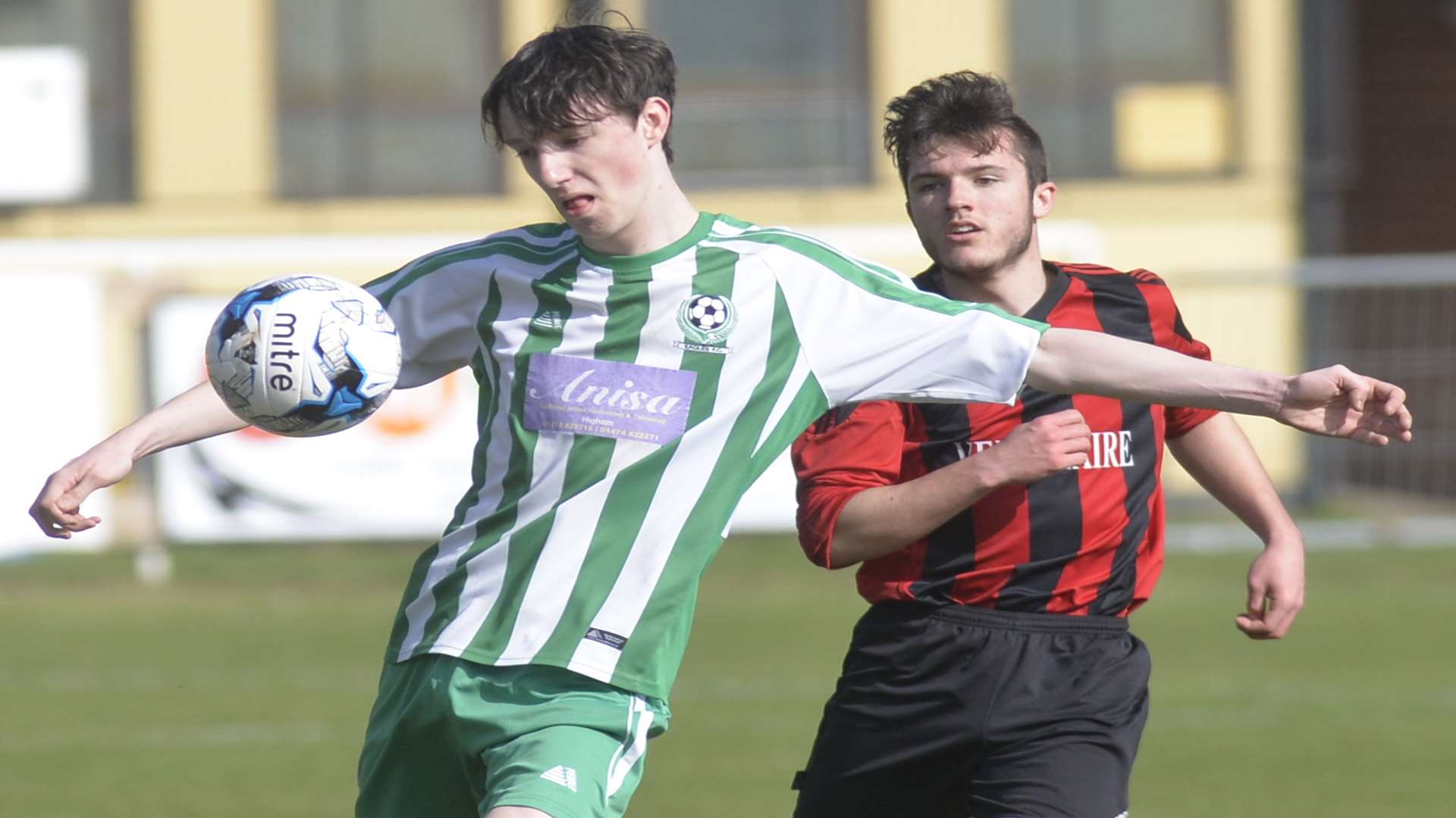 Eagles under-18s (green) get to the ball ahead of Woodcoombe Youth in the John Leeds Trophy final Picture: Ruth Cuerden